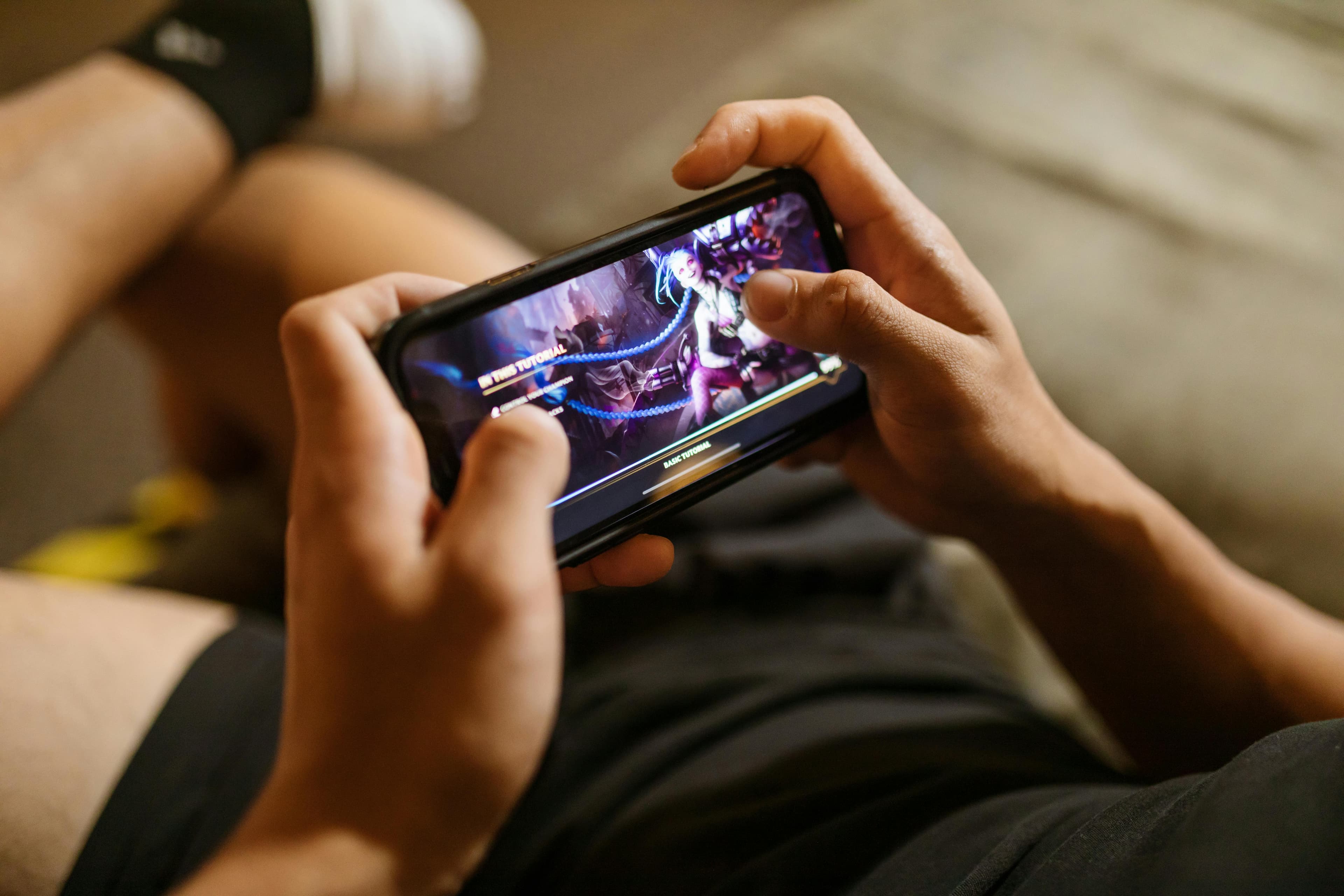 Close-up of a person playing a mobile game